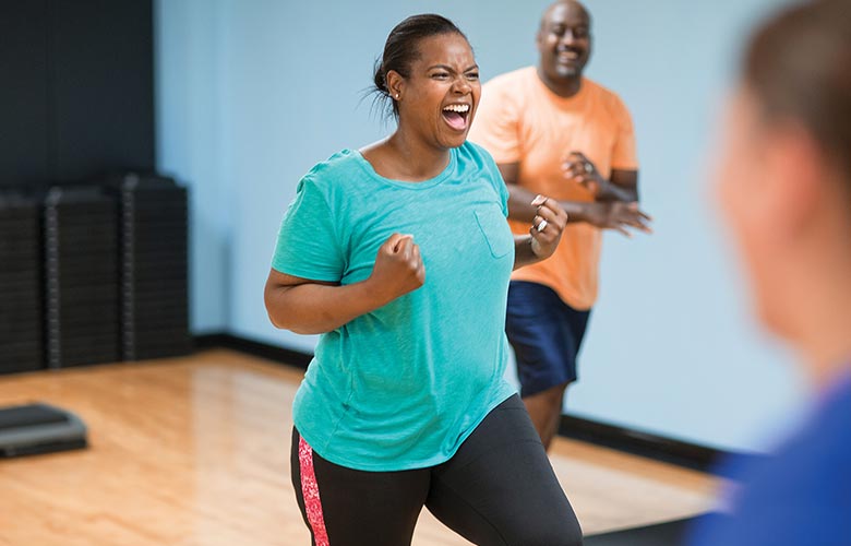 Woman exalts in joy after successful workout