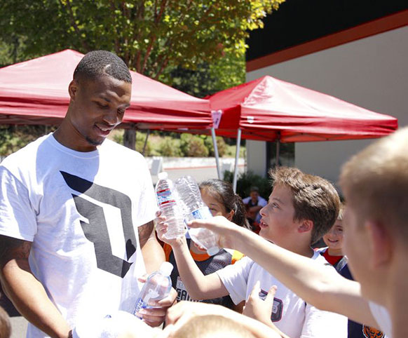 Portland Trailblazers star Damian Lillard at a YMCA basketball camp