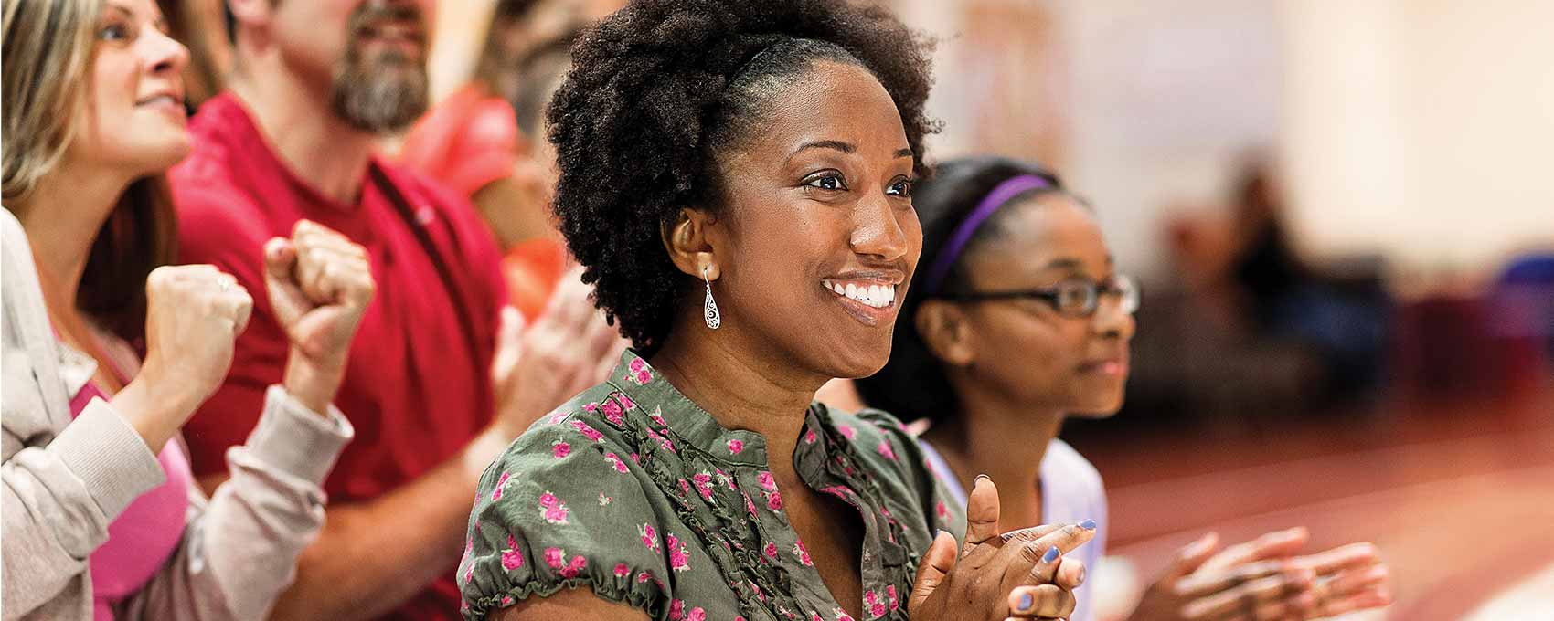 Woman cheering on the sidelines
